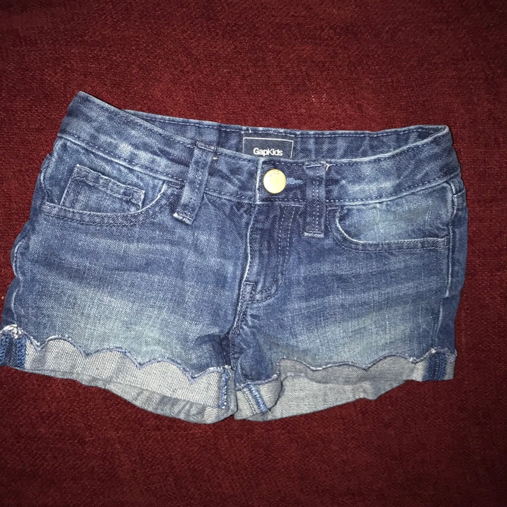 Gap Kids girls denim short with scalloped detail.
